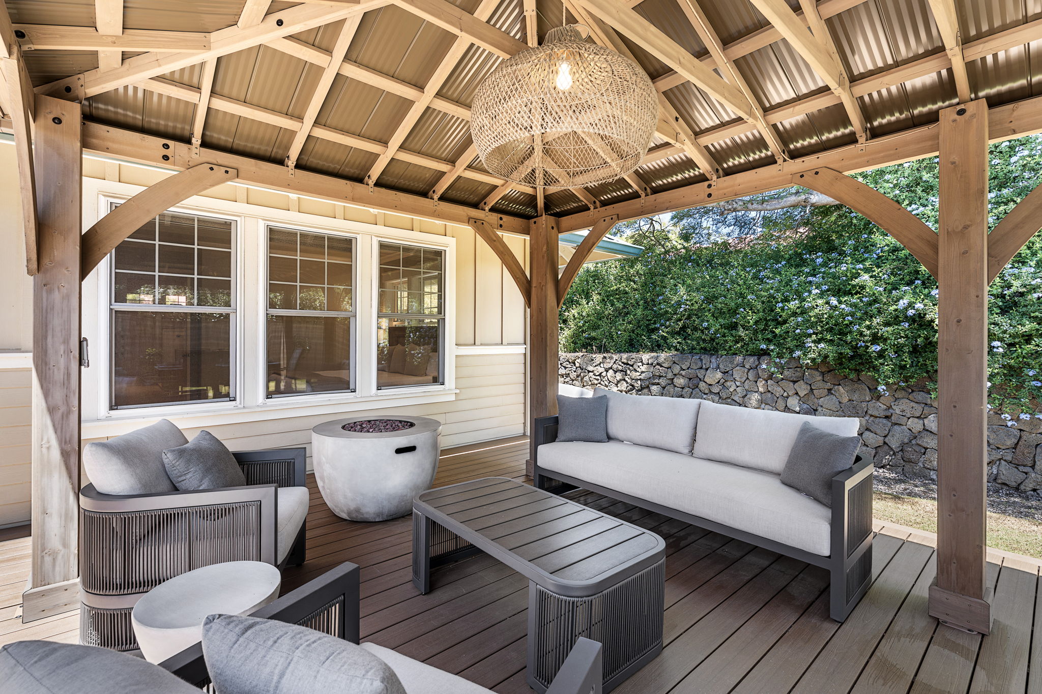 65-1294 Hoku Road Kamuela, HI 96743 - Photo 20 of 30 a view of a patio with couches and a dining table and chairs with wooden floor