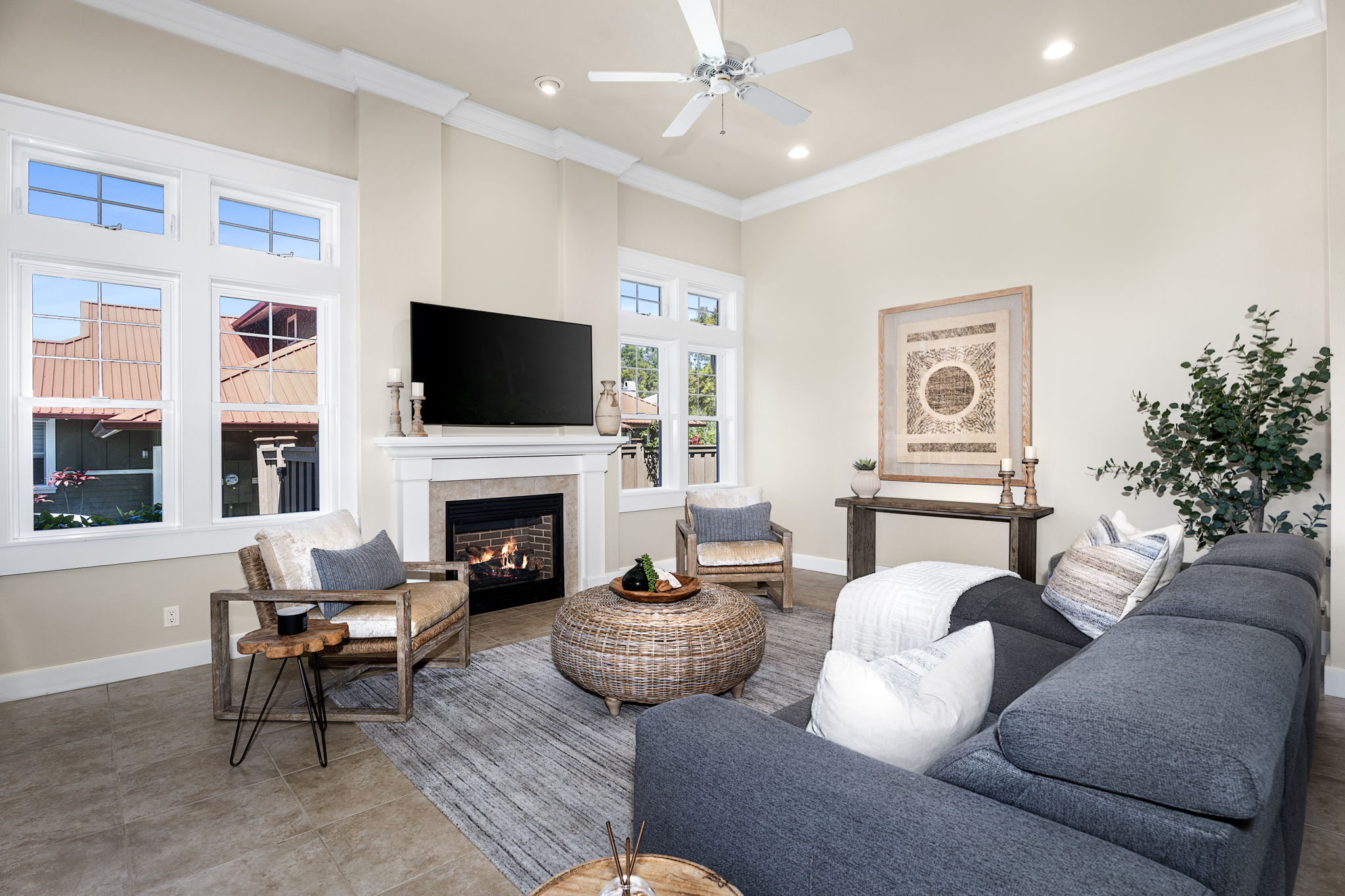 65-1294 Hoku Road Kamuela, HI 96743 - Photo 3 of 30 a living room with furniture a fireplace and a flat screen tv