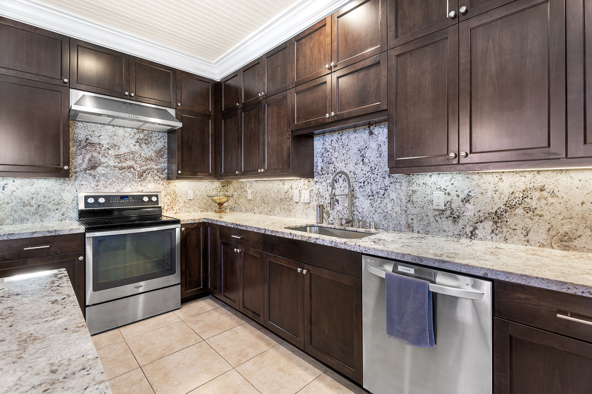 65-1294 Hoku Road Kamuela, HI 96743 - Photo 6 of 30 a kitchen with stainless steel appliances granite countertop a sink stove and cabinets