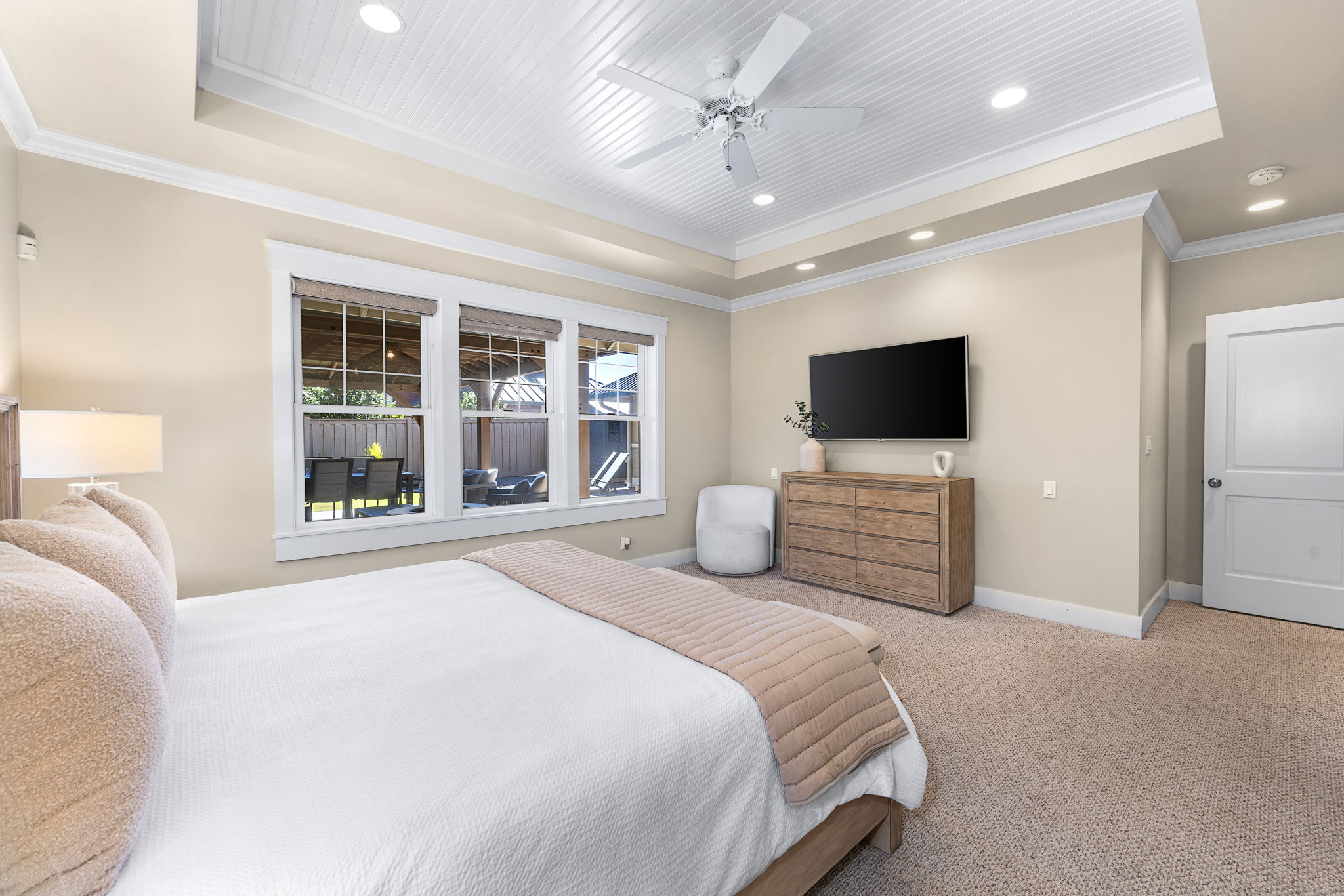 65-1294 Hoku Road Kamuela, HI 96743 - Photo 8 of 30 a spacious bedroom with a bed and a flat screen tv