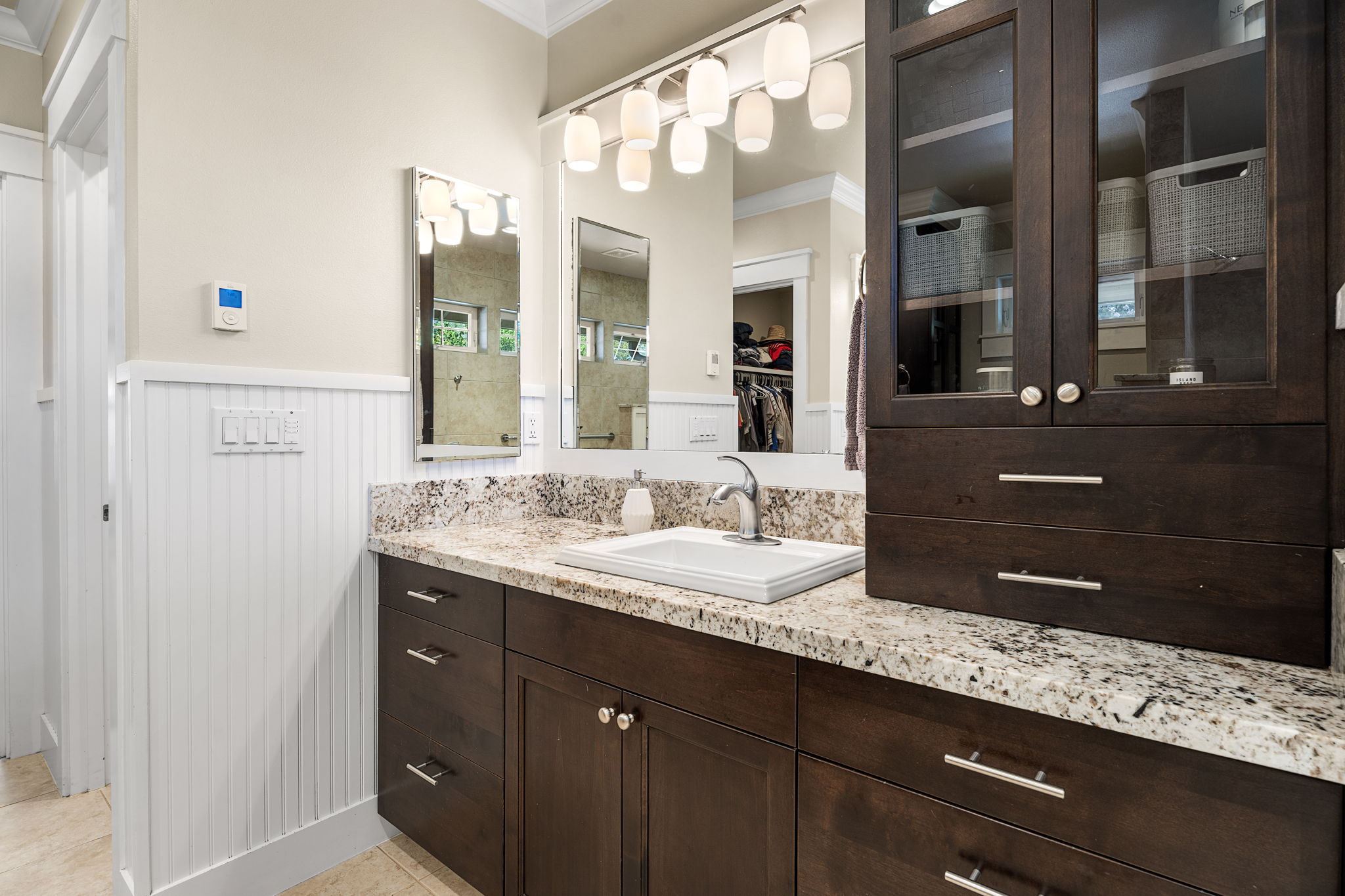 65-1294 Hoku Road Kamuela, HI 96743 - Photo 9 of 30 a bathroom with a granite countertop sink double vanity and a mirror
