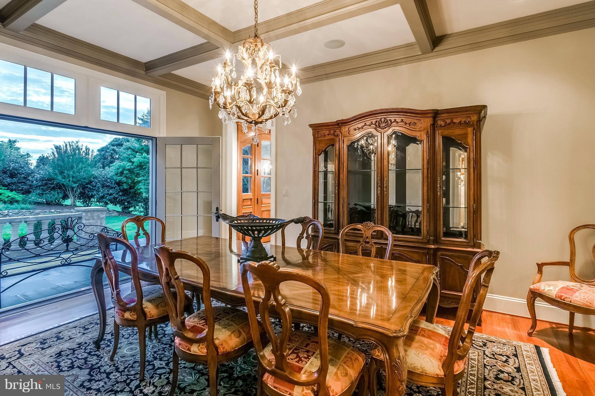 5 Hayfields Road Hunt Valley, MD 21030 - Photo 12 of 30 a view of a dining room with furniture a chandelier and large window