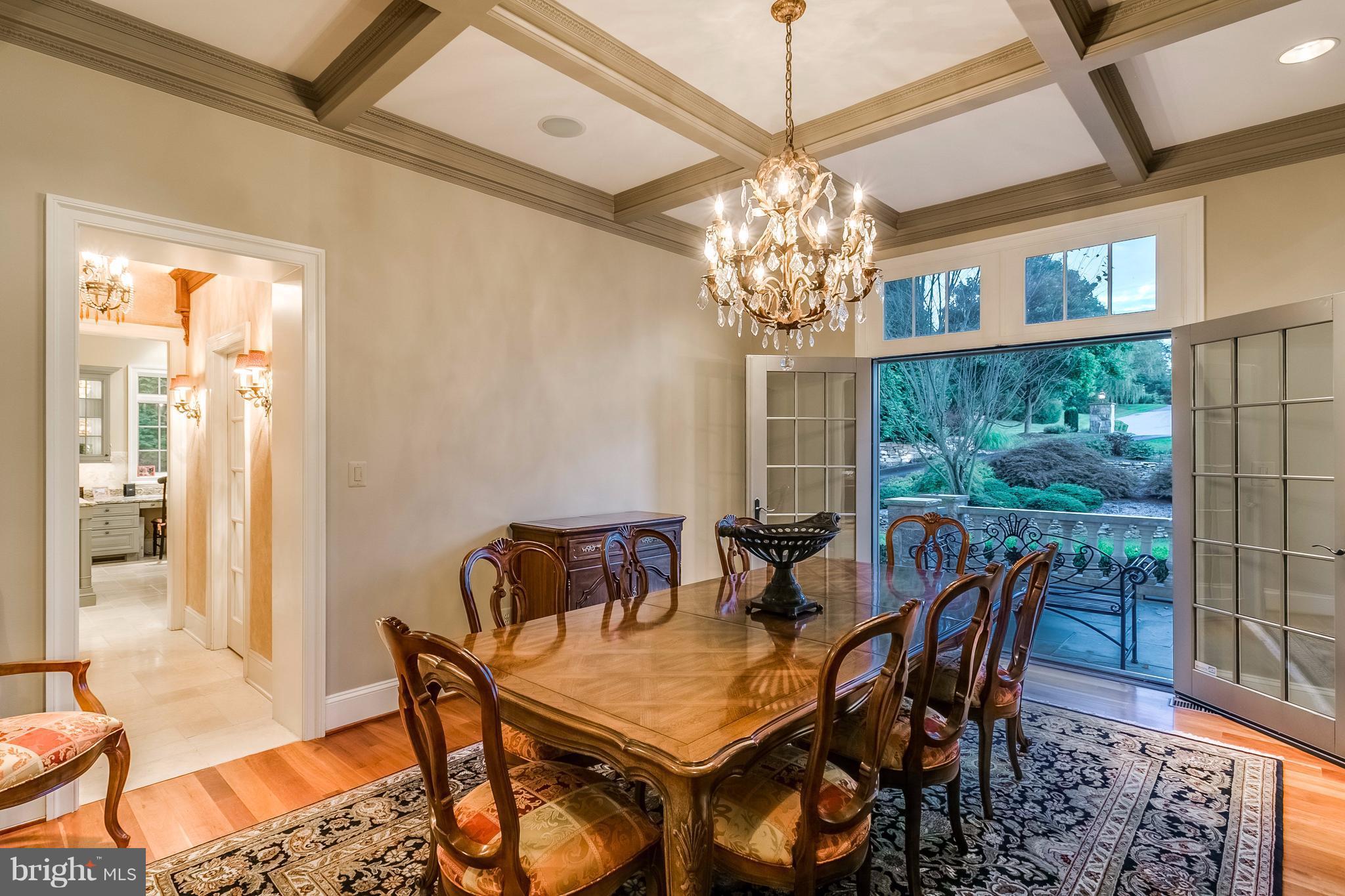 5 Hayfields Road Hunt Valley, MD 21030 - Photo 13 of 30 a view of a dining room with furniture a chandelier and wooden floor