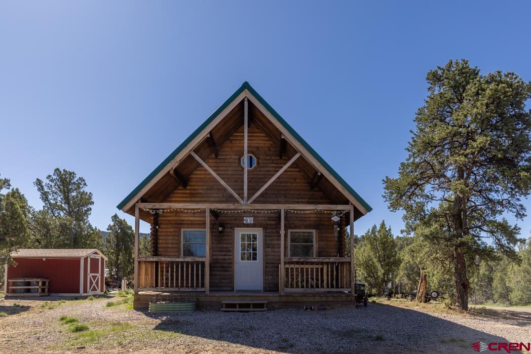 553 Cow Canyon Road Ignacio, CO 81137 - Photo 2 of 34 a front view of a house with a yard