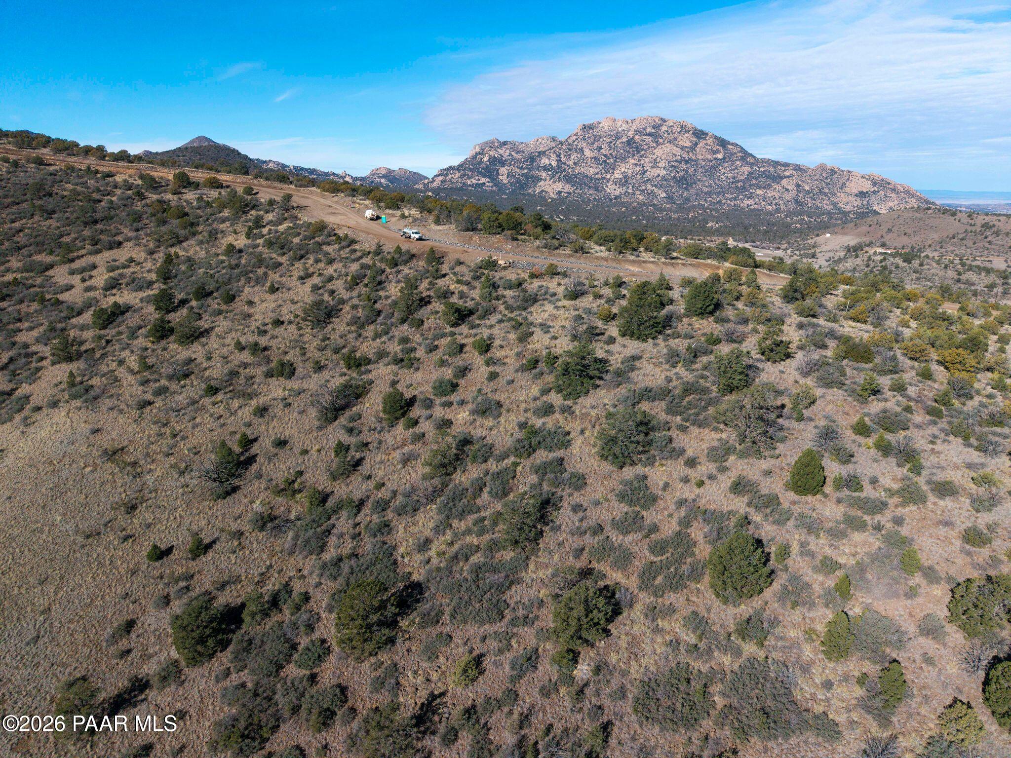 2273 West Ridge View Trail Prescott, AZ 86305 - Photo 12 of 13 a view of a dry yard with mountains in the background