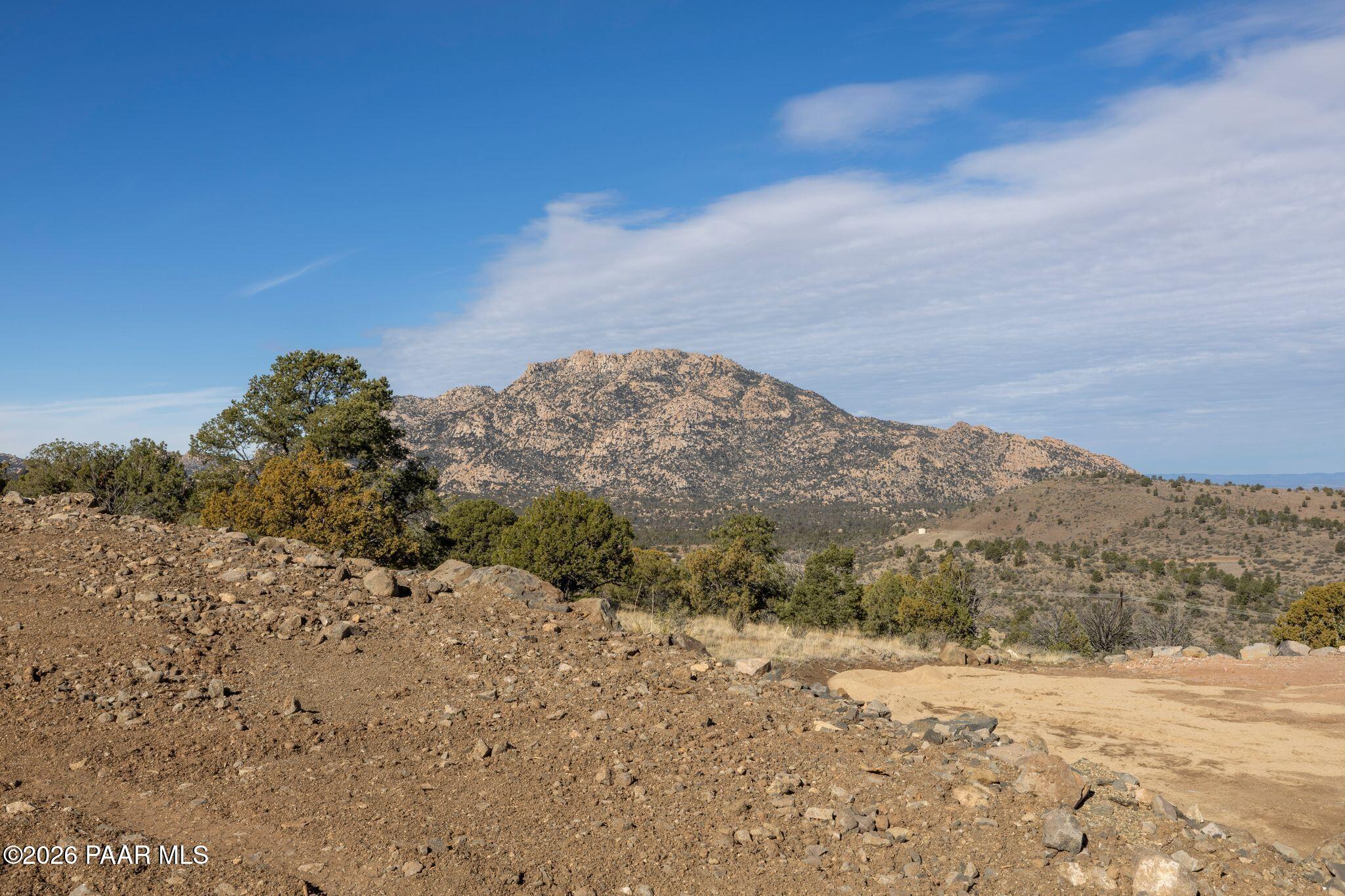 2273 West Ridge View Trail Prescott, AZ 86305 - Photo 9 of 13 a view of a dry yard with mountains in the background