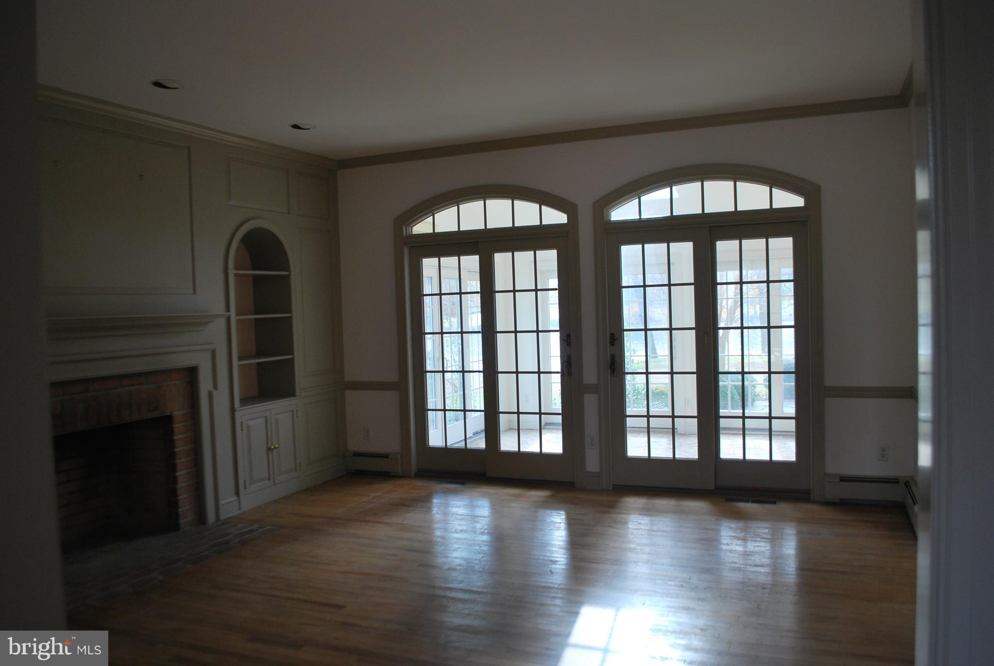 Living room with wood burning fireplace