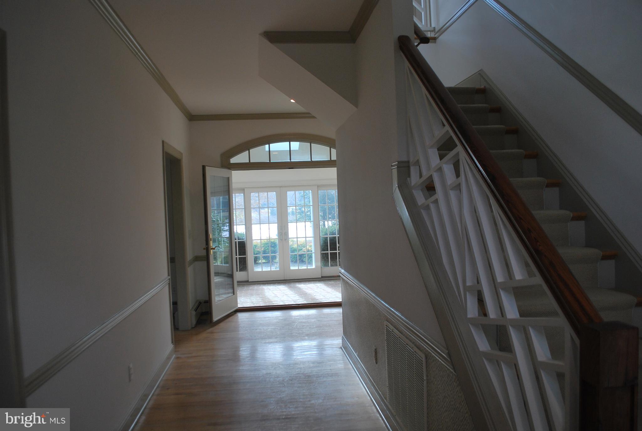 Entrance with view through home to water