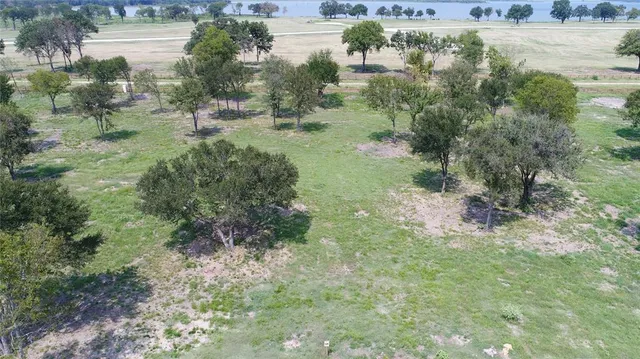 a view of a lake with a building in the background