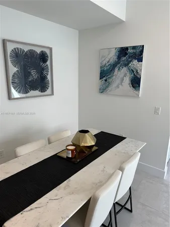 a bedroom with a bed and wall painting