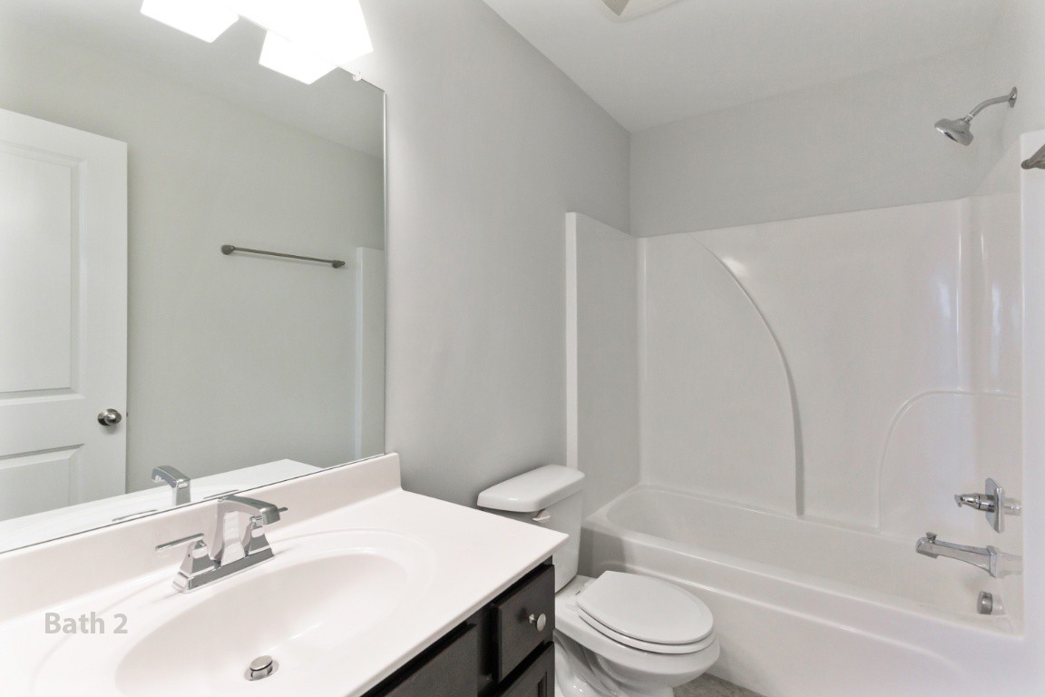 653 Castle Road Mount Juliet, TN 37122 - Photo 19 of 29 a bathroom with a sink toilet and shower