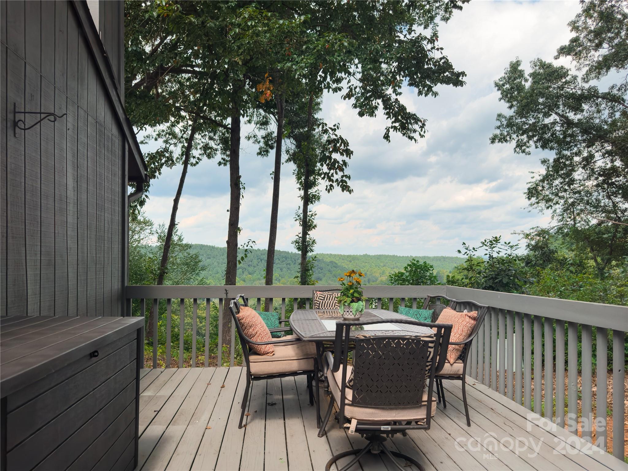 907 Victory Trail Morganton, NC 28655 - Photo 14 of 32 an outdoor sitting area with furniture and wooden floor