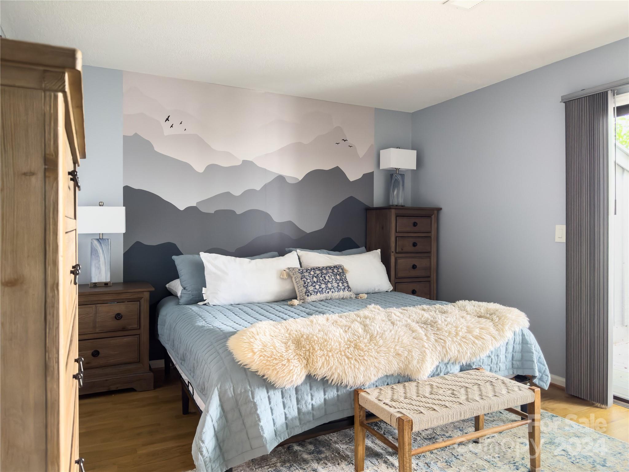 907 Victory Trail Morganton, NC 28655 - Photo 16 of 32 a bedroom with a bed and wooden floor