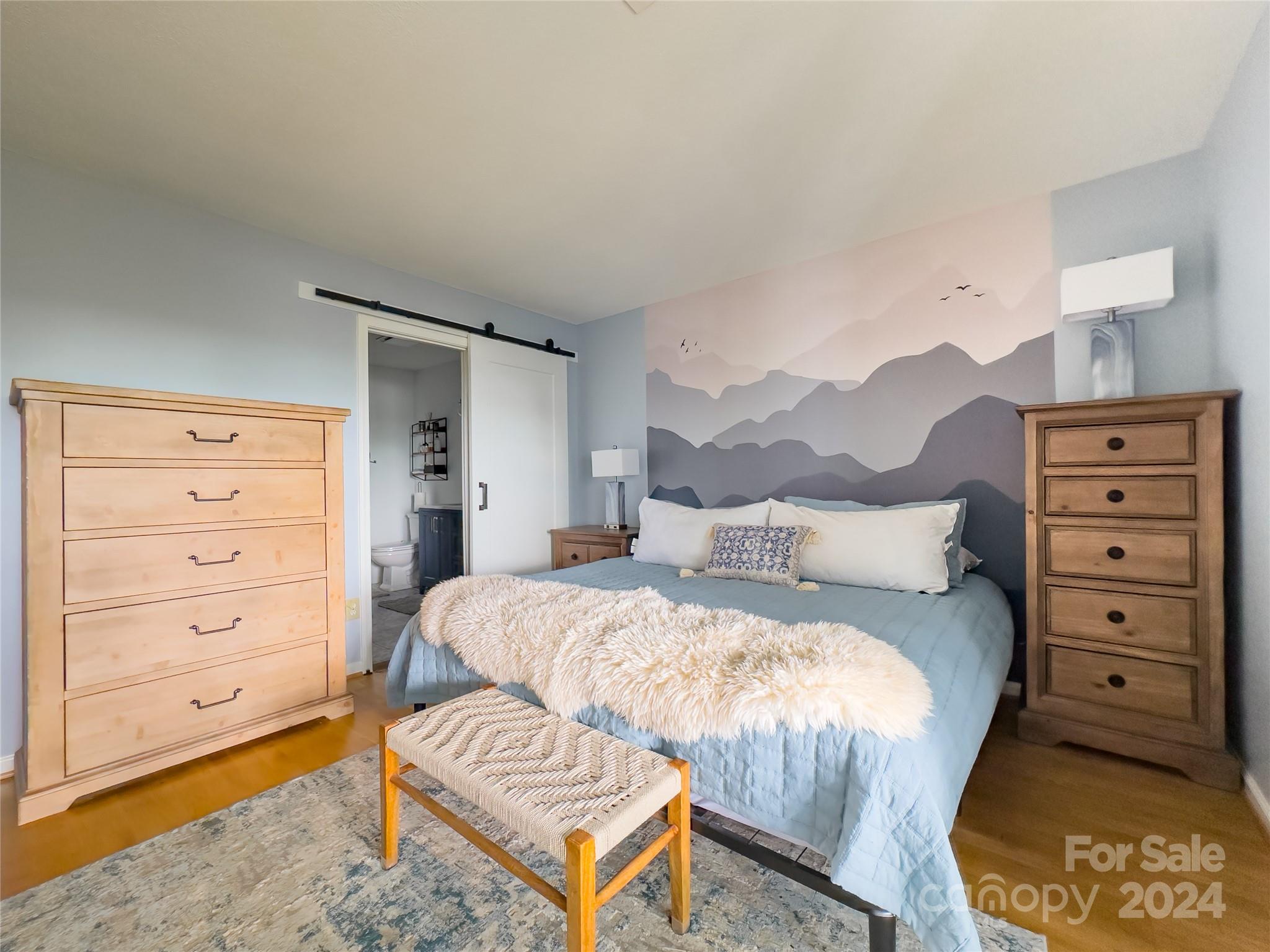 907 Victory Trail Morganton, NC 28655 - Photo 17 of 32 a bedroom with a bed and a dresser