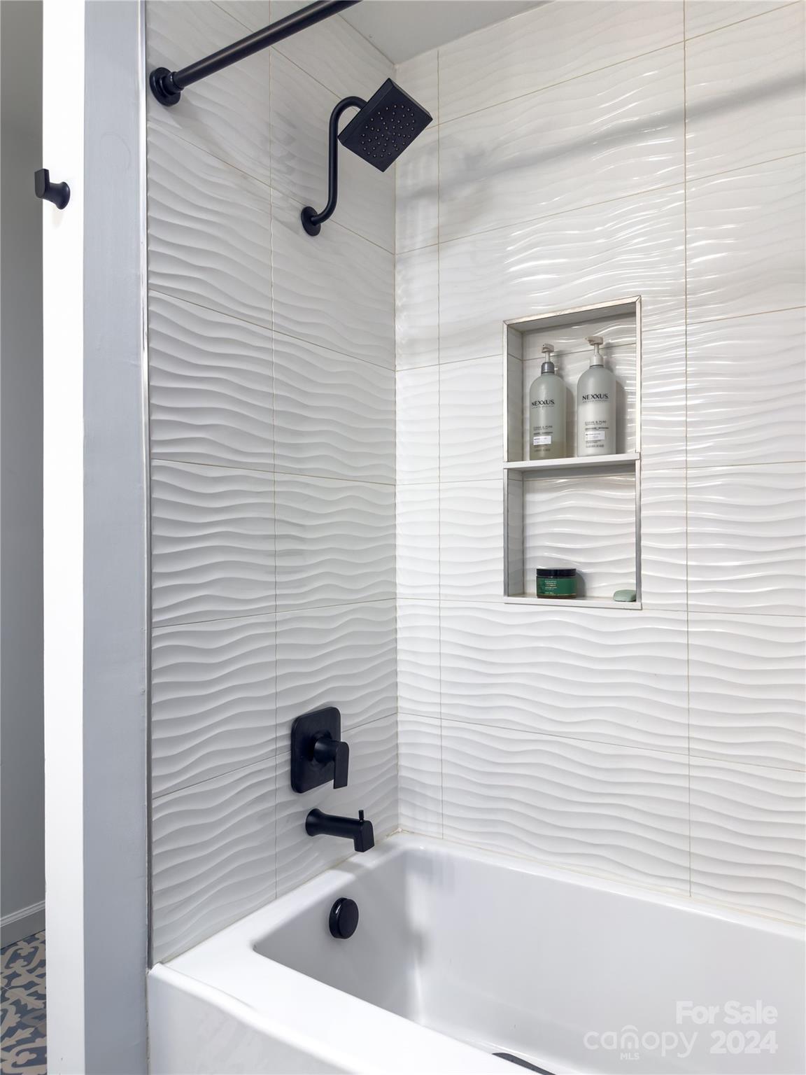 907 Victory Trail Morganton, NC 28655 - Photo 24 of 32 a bathroom with a sink and a bathtub