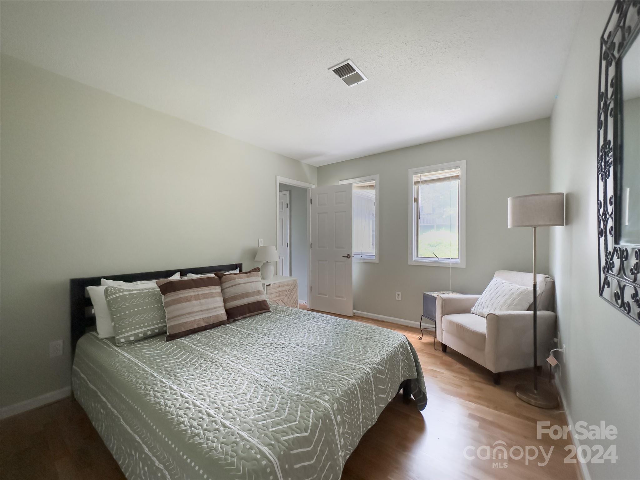 907 Victory Trail Morganton, NC 28655 - Photo 25 of 32 a bedroom with a bed and a couch