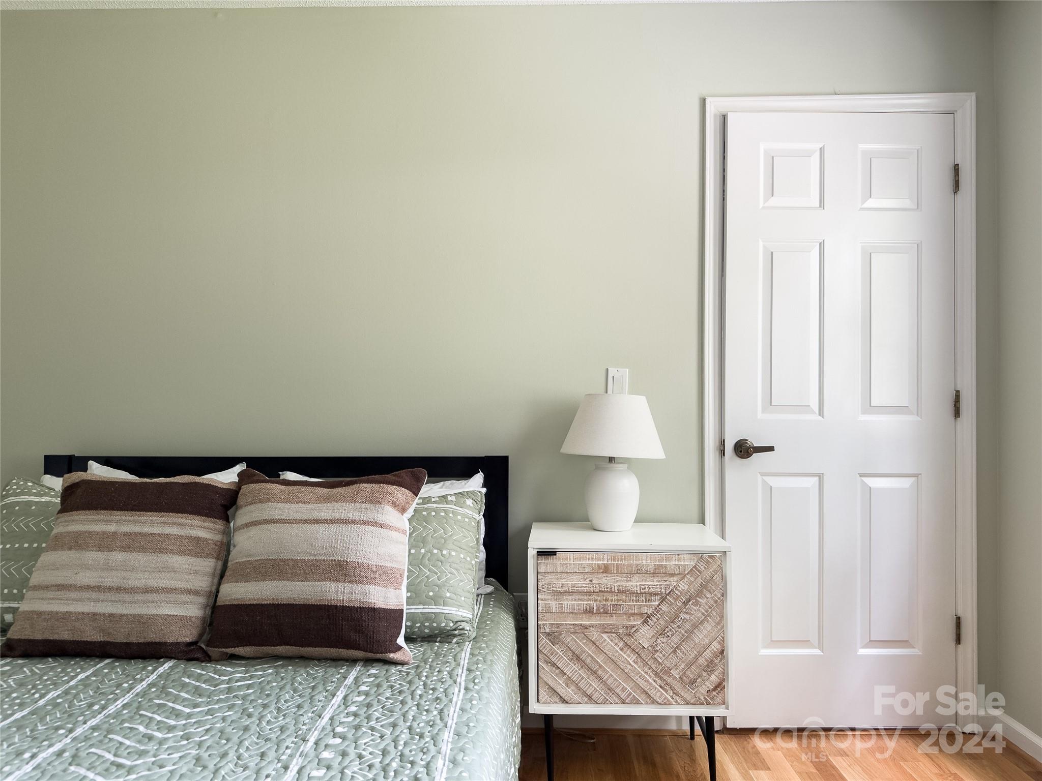 907 Victory Trail Morganton, NC 28655 - Photo 26 of 32 a bedroom with a bed and couch