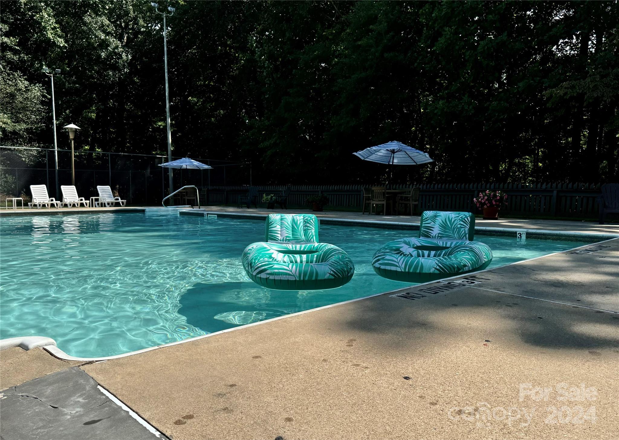 907 Victory Trail Morganton, NC 28655 - Photo 31 of 32 a view of a garden with an outdoor seating