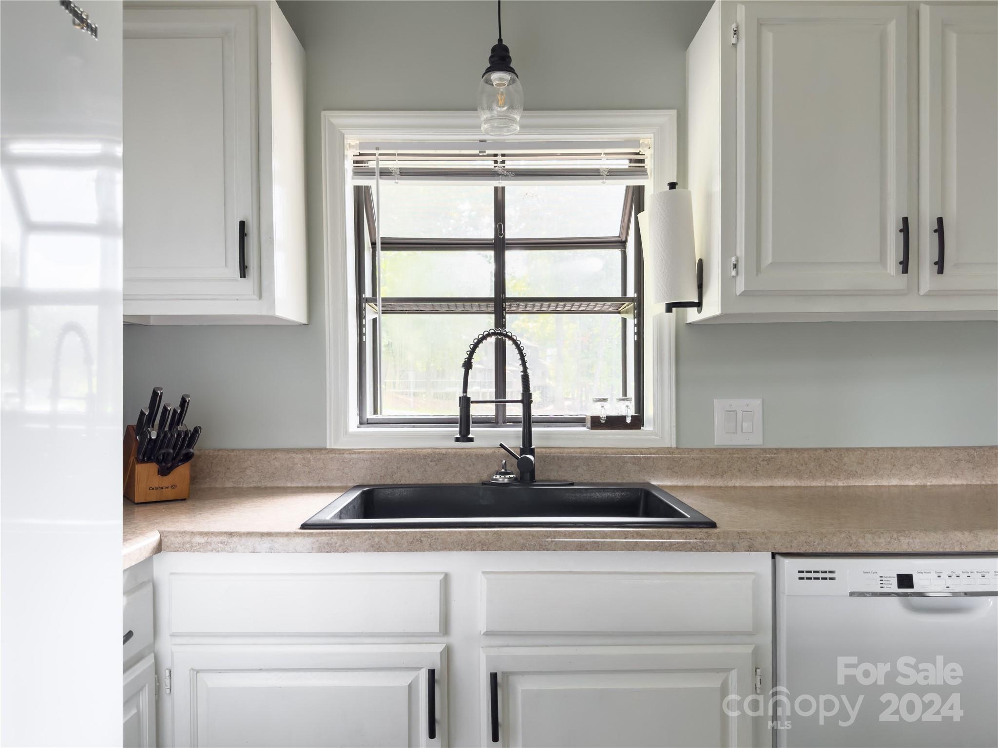 907 Victory Trail Morganton, NC 28655 - Photo 5 of 32 a kitchen with a sink and a window
