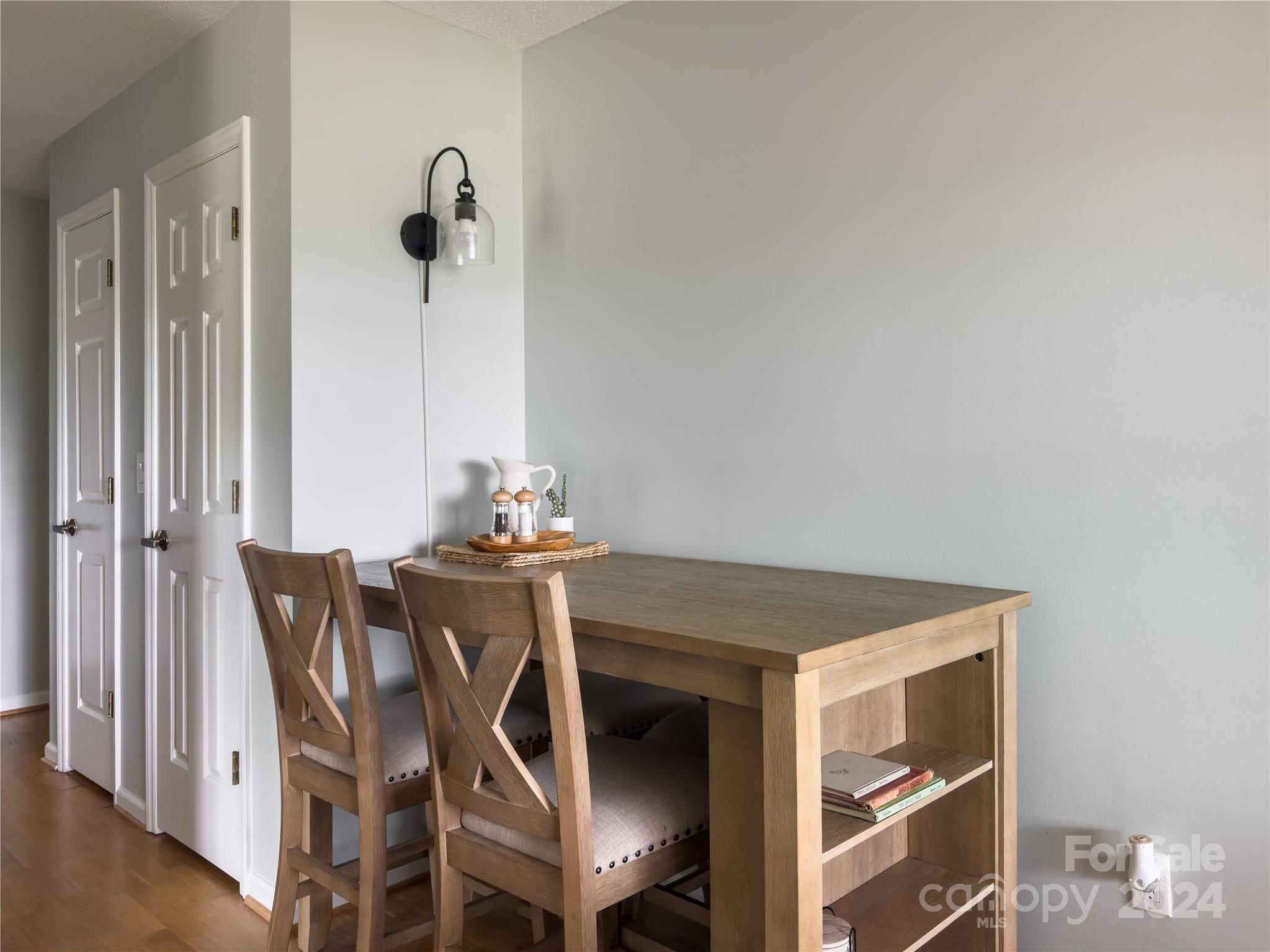 907 Victory Trail Morganton, NC 28655 - Photo 9 of 32 a view of a dining room with furniture and wooden floor