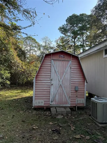 a backyard of a house with wooden fence