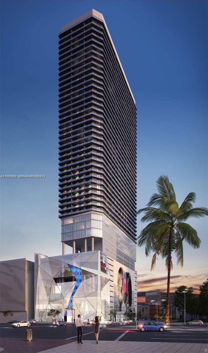 398 Northeast 5th Street, Unit 4708 Miami, FL 33132 - Photo 1 of 12 a front view of a building with palm trees