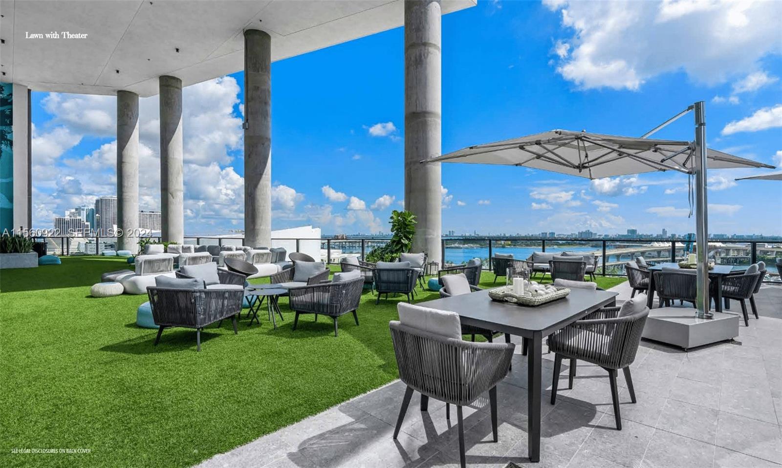 398 Northeast 5th Street, Unit 4708 Miami, FL 33132 - Photo 4 of 12 a view of a patio with chairs and a table