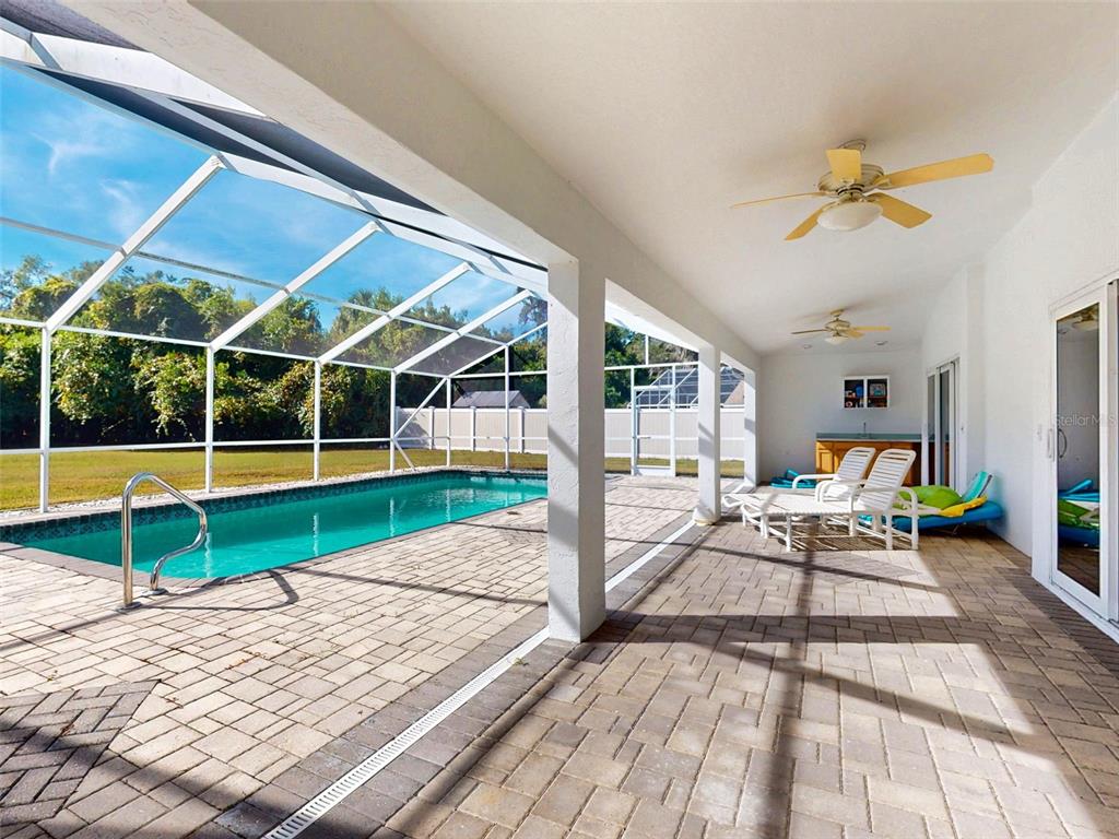 7558 Southwest 103rd Loop Ocala, FL 34476 - Photo 25 of 38 a house view with a backyard space