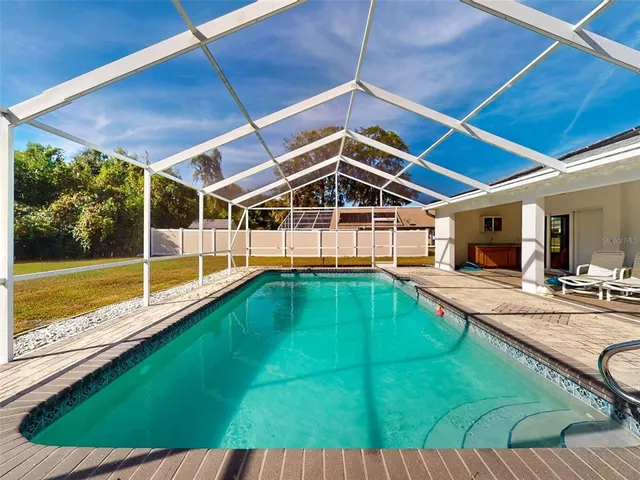 a view of a swimming pool with a patio