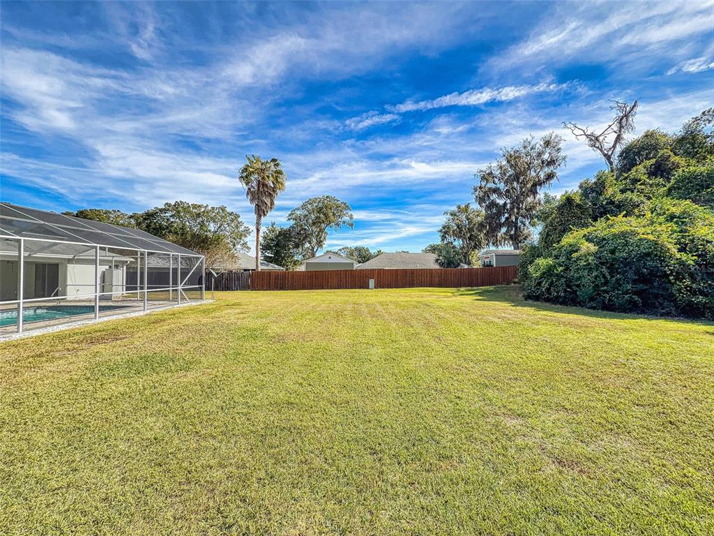 7558 Southwest 103rd Loop Ocala, FL 34476 - Photo 34 of 38 a swimming pool with an outdoor seating yard and mountain view