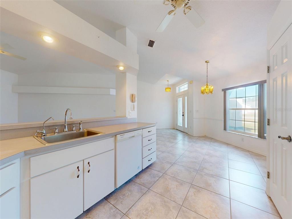 7558 Southwest 103rd Loop Ocala, FL 34476 - Photo 7 of 38 a spacious bathroom with a granite countertop sink a toilet and a bathtub