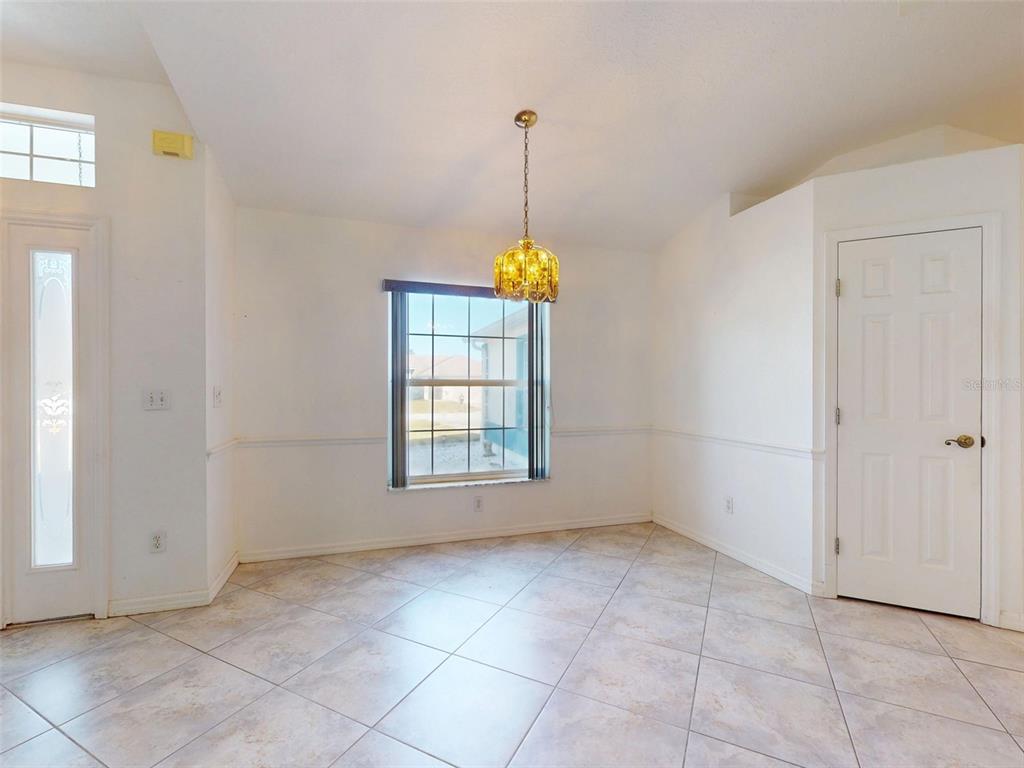 7558 Southwest 103rd Loop Ocala, FL 34476 - Photo 10 of 38 a view of an empty room with windows