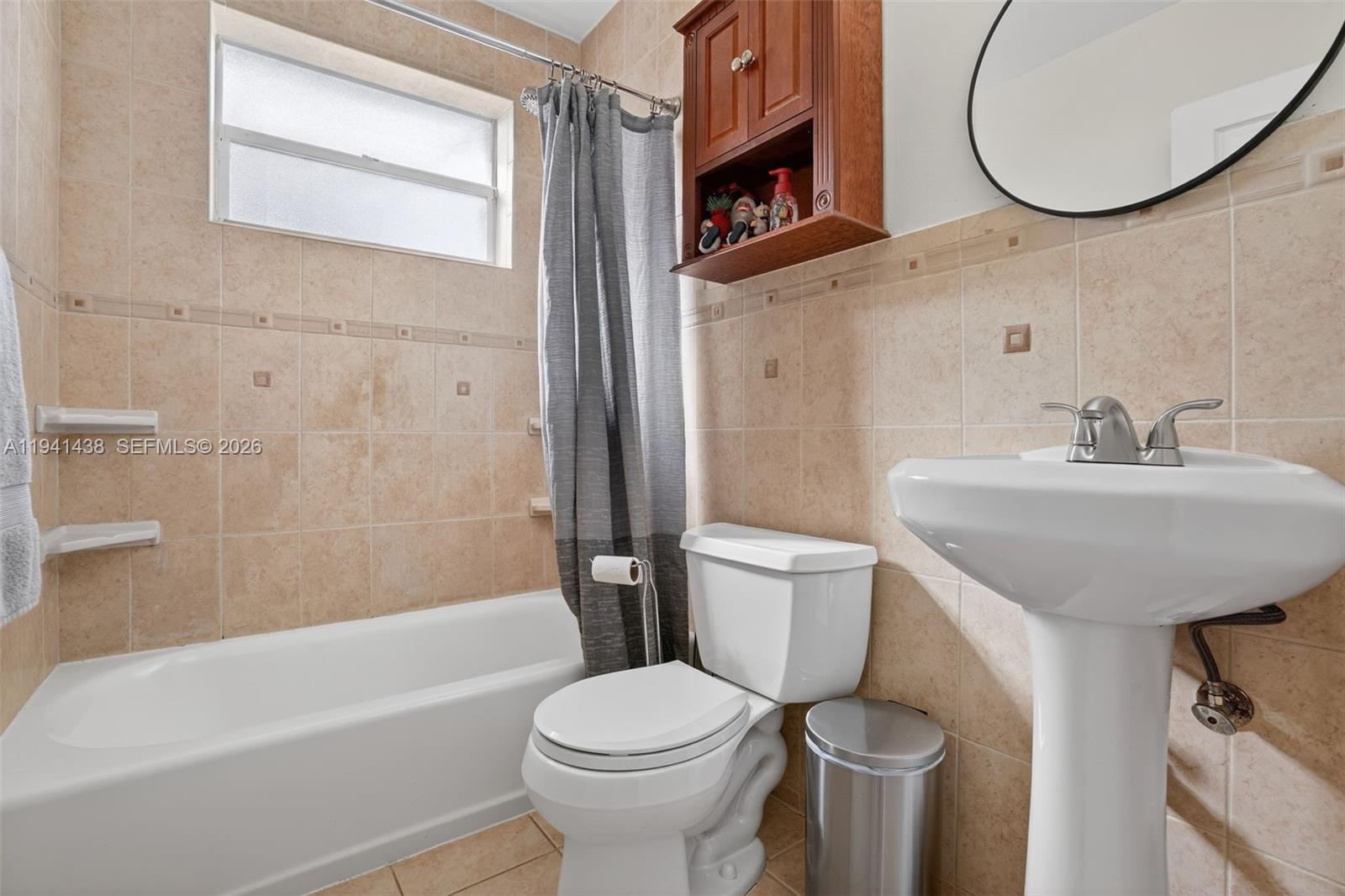 8500 Southwest 16th Street Miami, FL 33155 - Photo 11 of 26 a bathroom with a sink a toilet and a bathtub