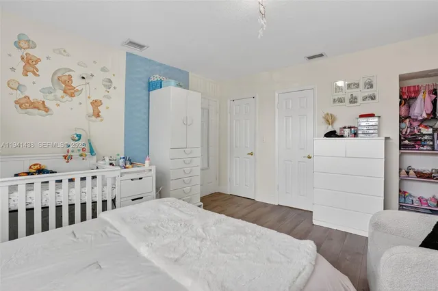 a bedroom with a bed and furniture