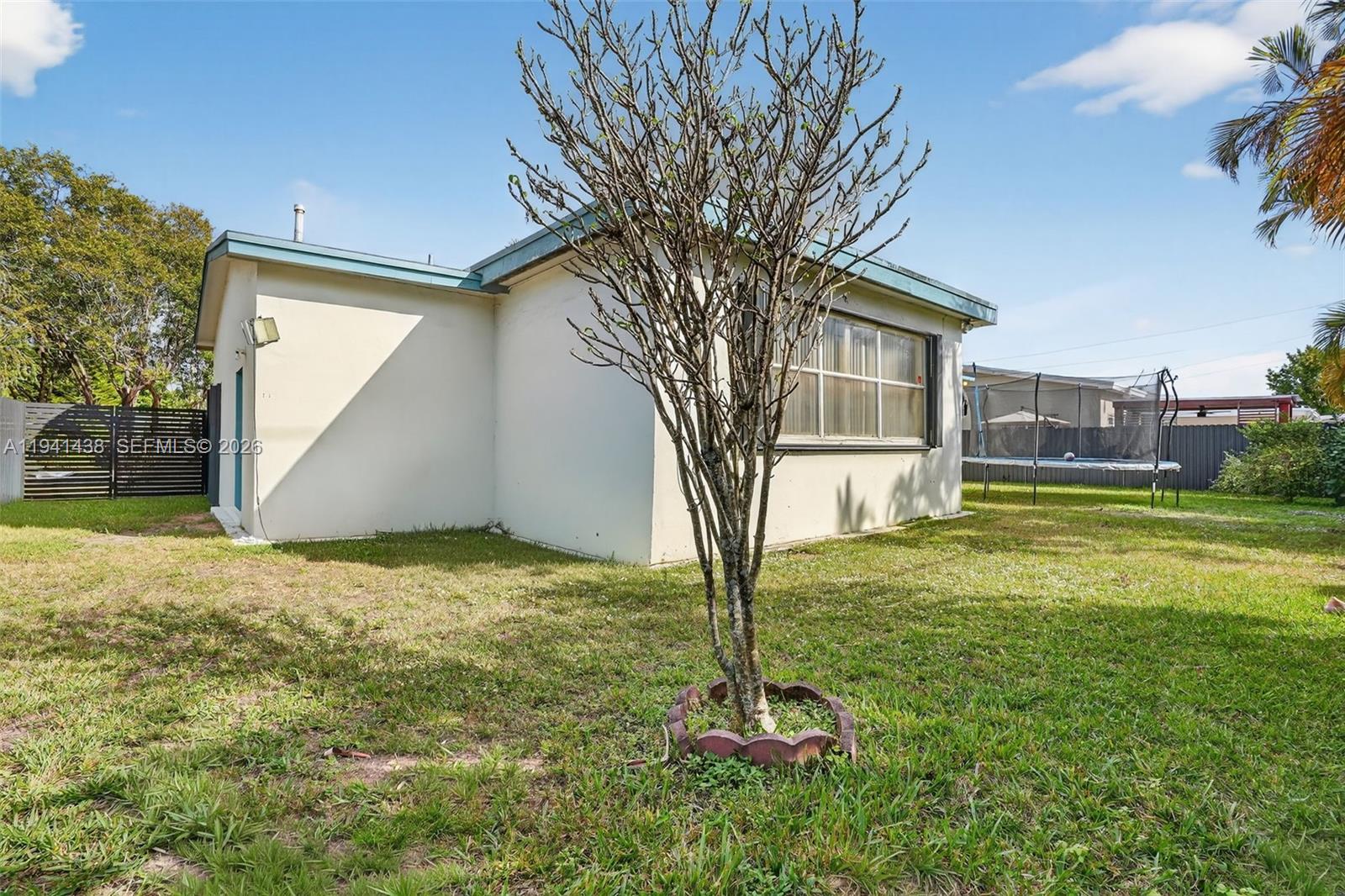 8500 Southwest 16th Street Miami, FL 33155 - Photo 17 of 26 a backyard of a house with lots of green space
