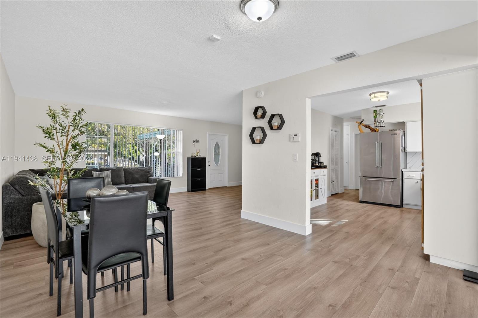 8500 Southwest 16th Street Miami, FL 33155 - Photo 6 of 26 a view of a dining room with furniture and wooden floor