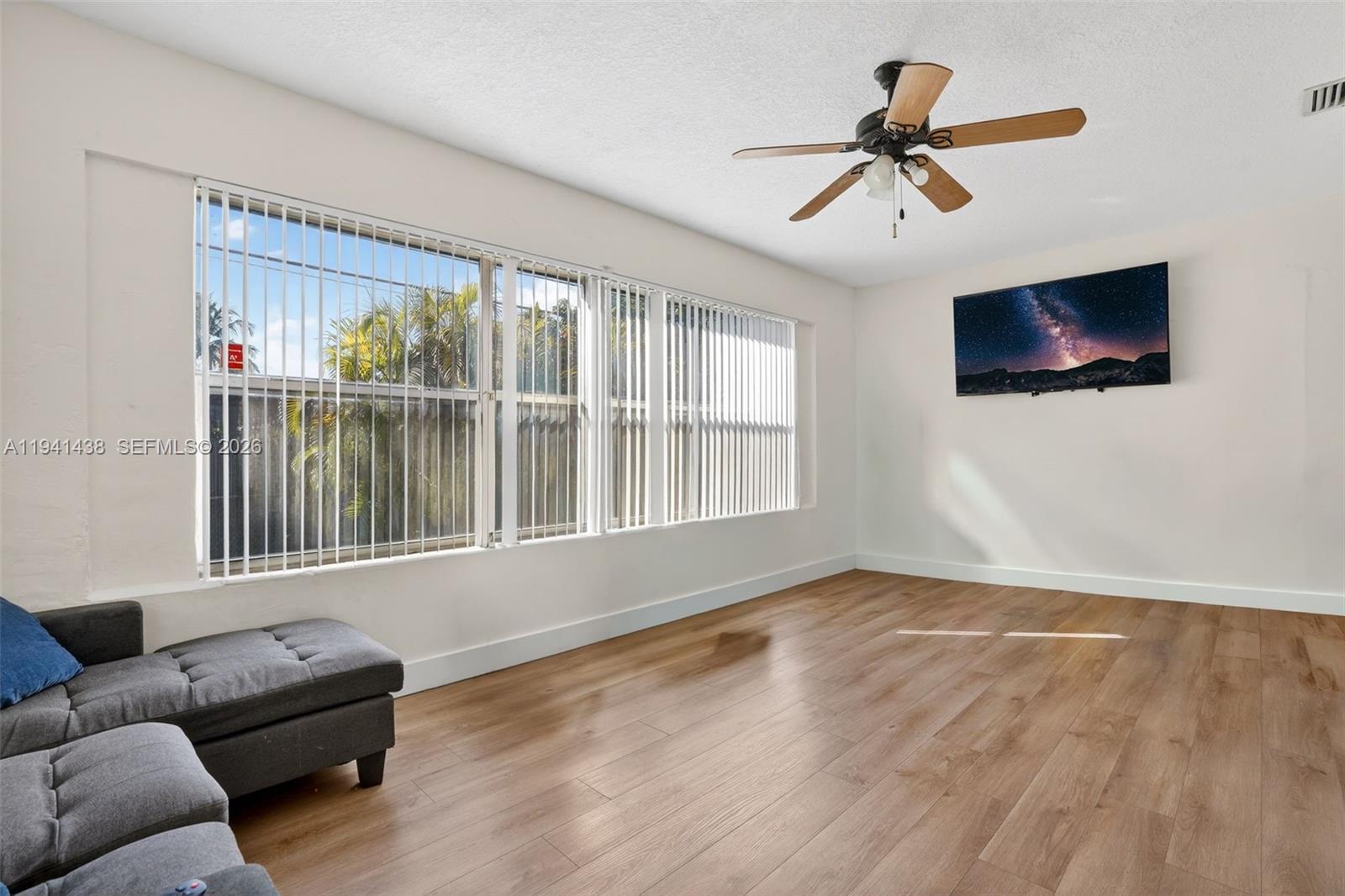 8500 Southwest 16th Street Miami, FL 33155 - Photo 7 of 26 a living room with furniture and a flat screen tv