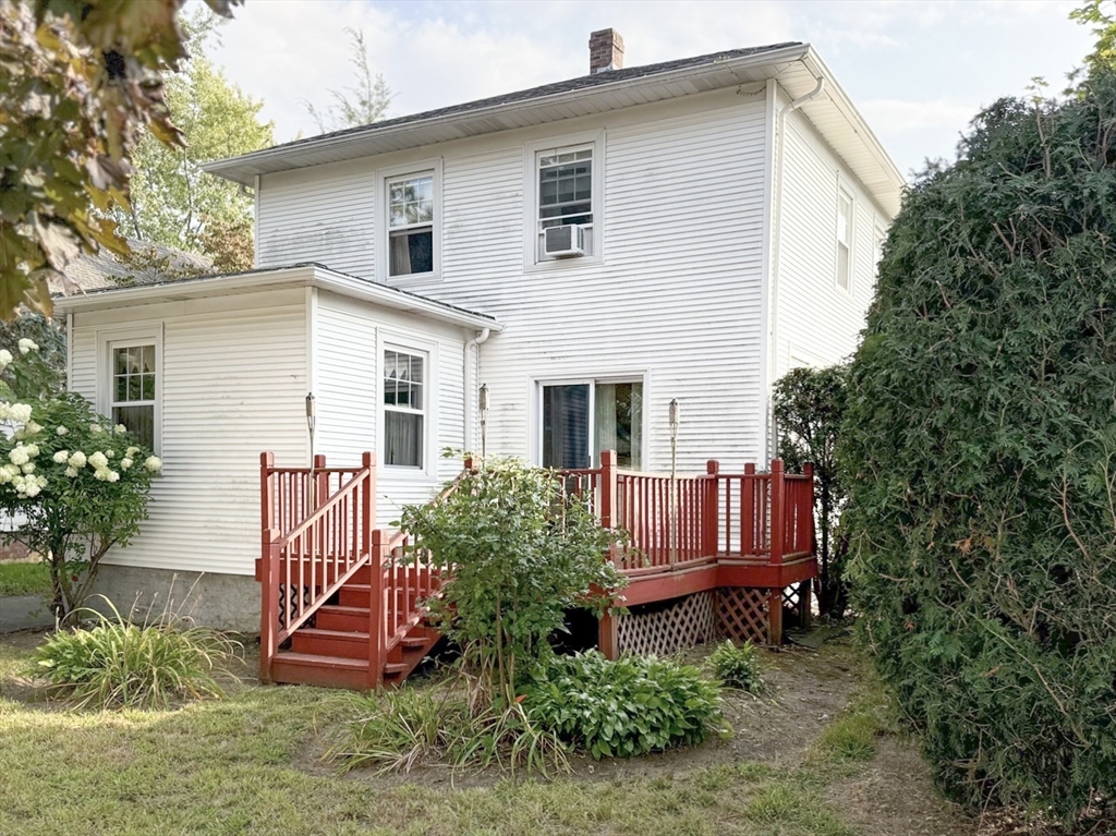 349 Aqueduct Road Cranston, RI 02910 - Photo 8 of 20 a view of a house with a yard and sitting area