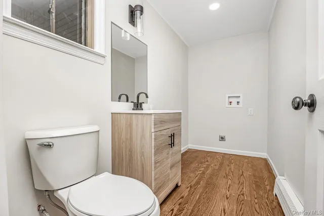 a view of empty room with window and chandelier