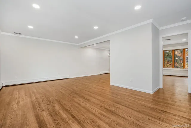 a bathroom with a granite countertop toilet sink and mirror