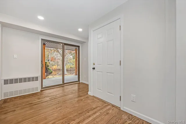 a view of an empty room with a fireplace