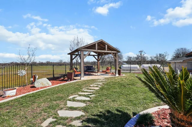 a view of a yard with an ocean view