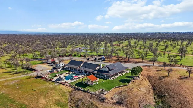 a utility room with stainless steel appliances granite countertop a stove and cabinets