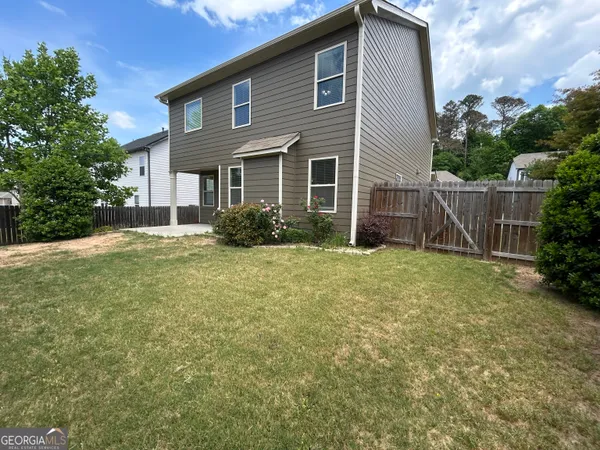 a front view of house with garden