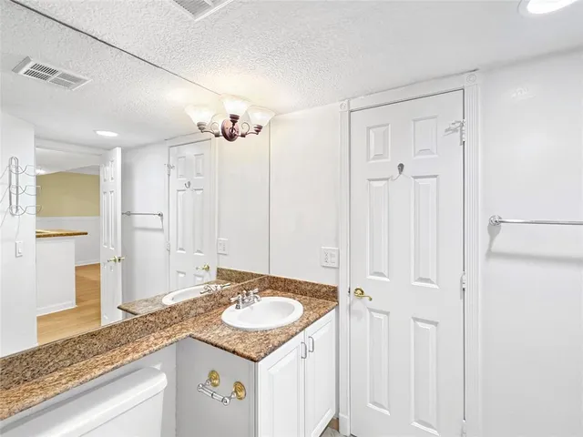 a view of front door of house with a yard