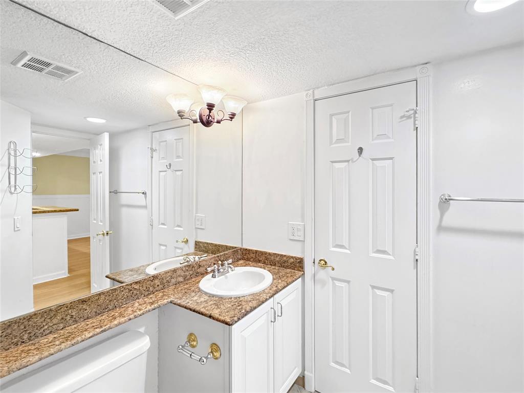 1515 East Broward Boulevard, Unit 107 Fort Lauderdale, FL 33301 - Photo 16 of 36 Stylish and functional bathroom with stone finishes