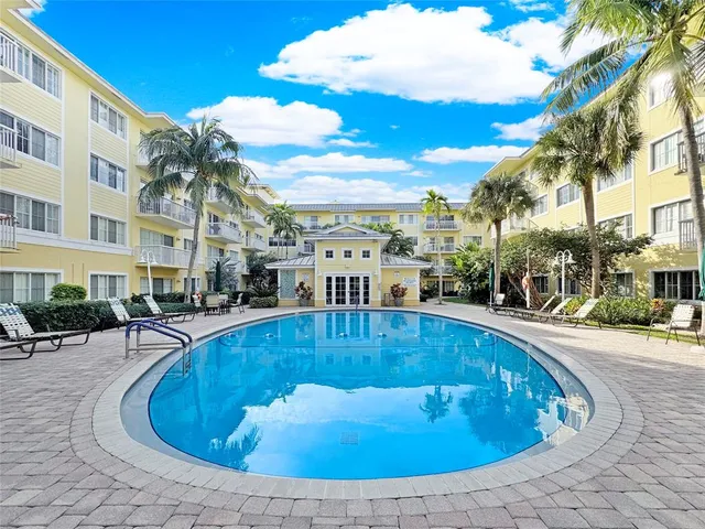 a view of a yard with chairs