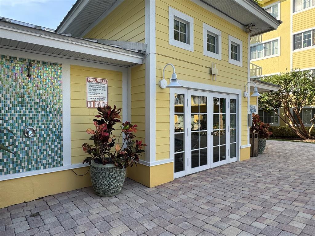 1515 East Broward Boulevard, Unit 107 Fort Lauderdale, FL 33301 - Photo 22 of 36 Gym entrance with outdoor shower for post-workout refreshment.