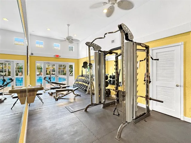 a dining hall with lots of tables a chandelier and living room view