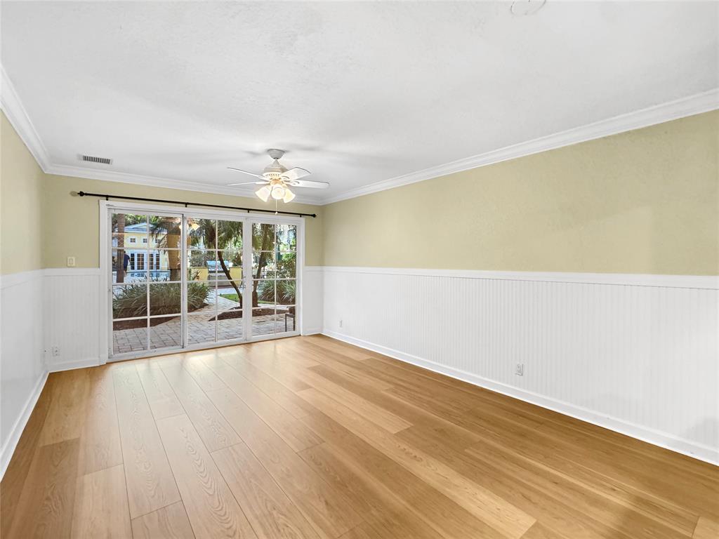 1515 East Broward Boulevard, Unit 107 Fort Lauderdale, FL 33301 - Photo 3 of 36 Spacious living room opens to a private patio with direct access to the pool, BBQ area, and gym. Ready for your personal style.